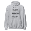 Unisex heather gray hoodie with Psalm 34:18 Bible verse printed in black text on front